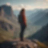 Confident woman standing tall on mountain peak