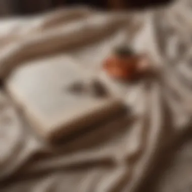 A cozy blanket enveloping a book of poetry with a bookmark peeking out