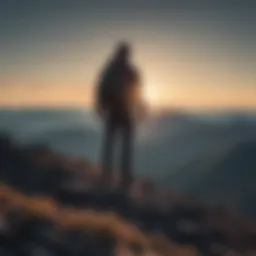 Silhouette of a man standing on a mountain peak