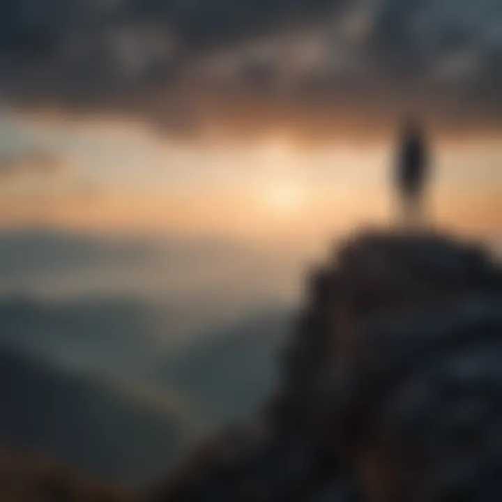 Silhouette of a person standing on a mountain peak overlooking a vast landscape