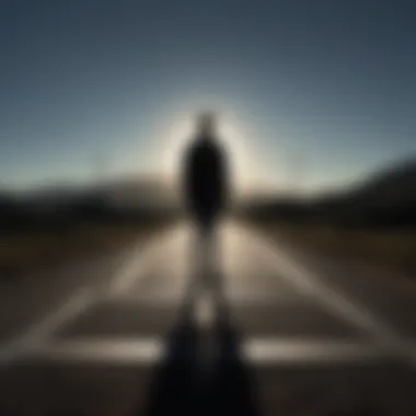 Silhouette of a person standing at a crossroads