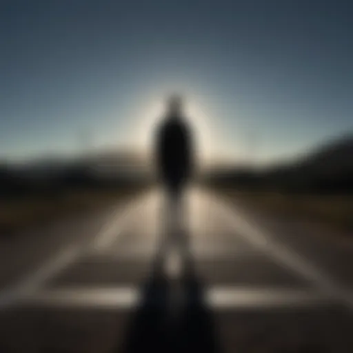 Silhouette of a person standing at a crossroads