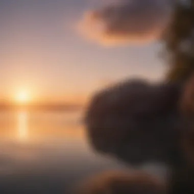 A tranquil scene of a sunset over water.