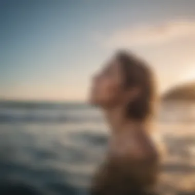 Person engaging in self-care routine by the ocean