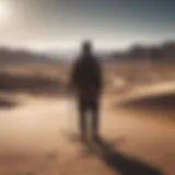 Silhouette of a person standing alone in a vast desert